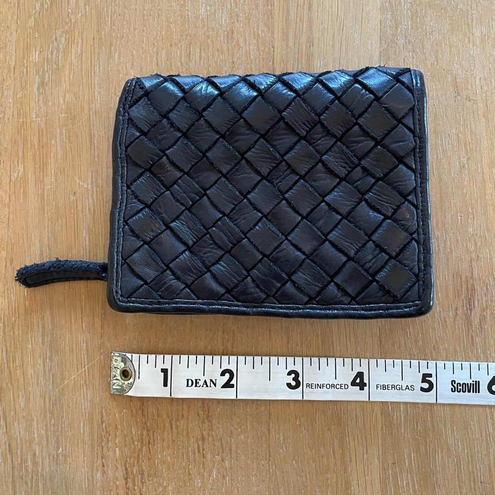 Black leather wallet, front is woven